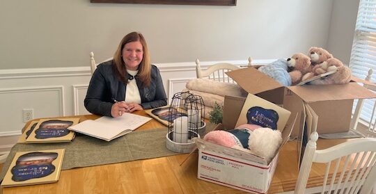 Laureen with her Bear Hug Project Boxes